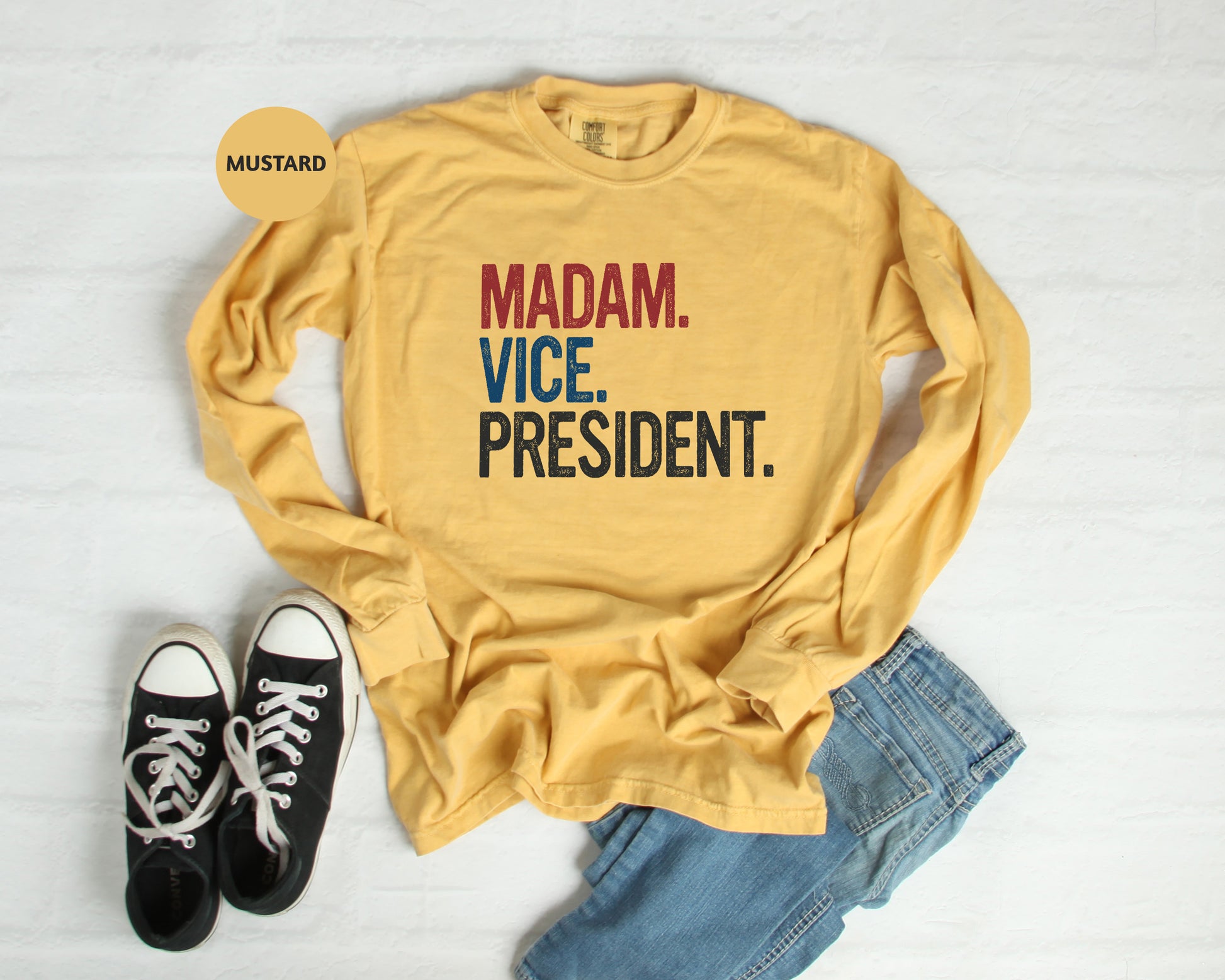 a yellow shirt that says madam vice president