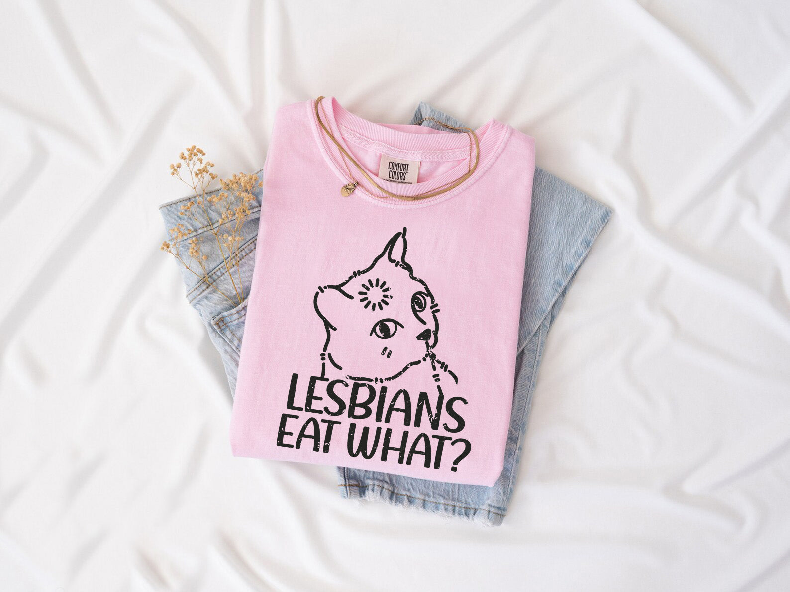 a pink shirt that says lesbians eat what?