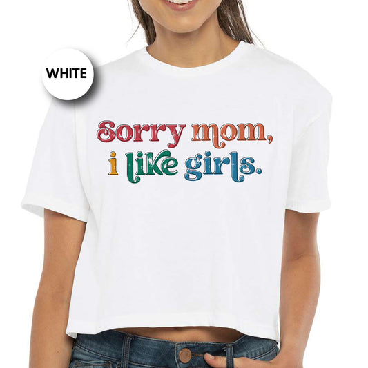 a woman wearing a white shirt that says sorry mom, i like girls