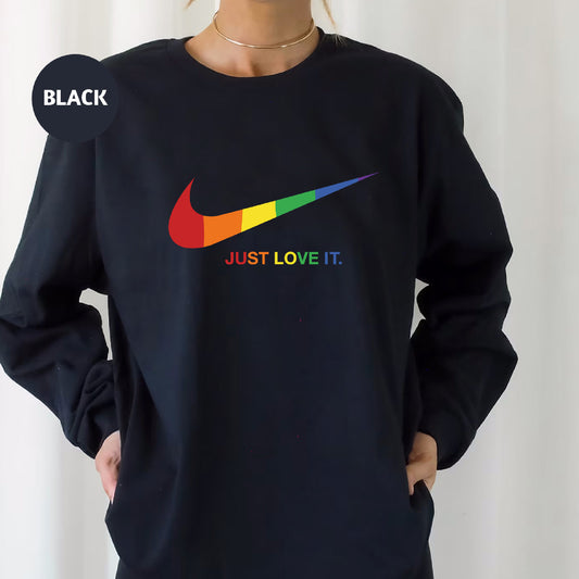 a woman wearing a black nike sweatshirt with the words just love it