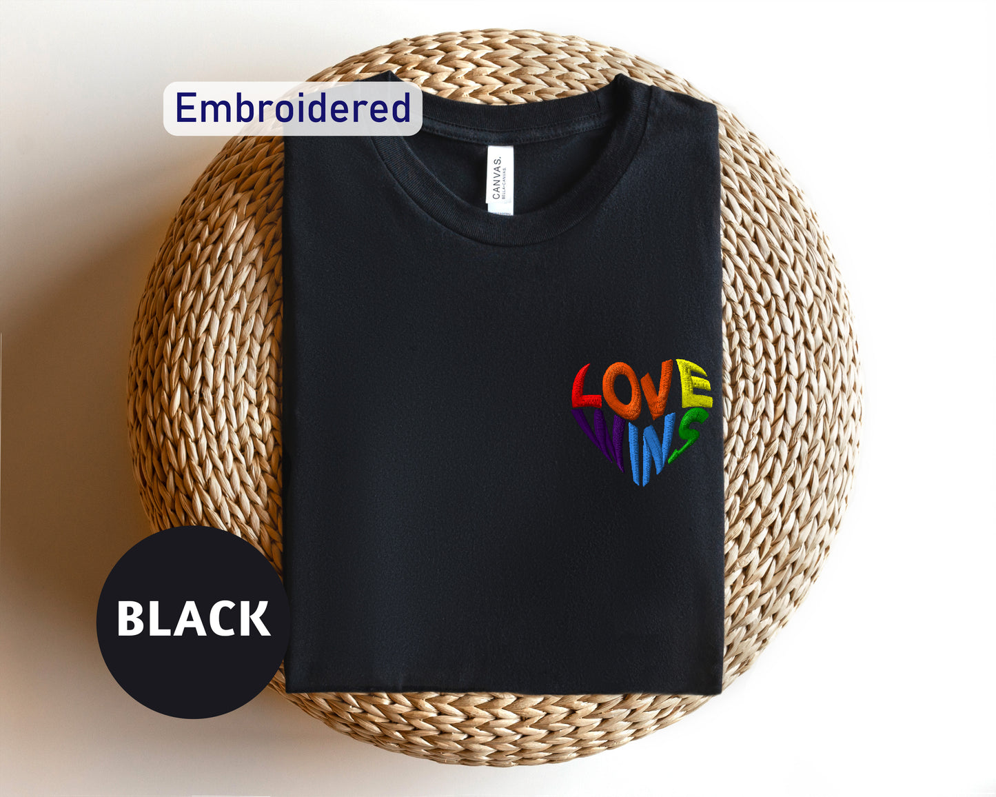 a black t - shirt with a colorful love in the middle