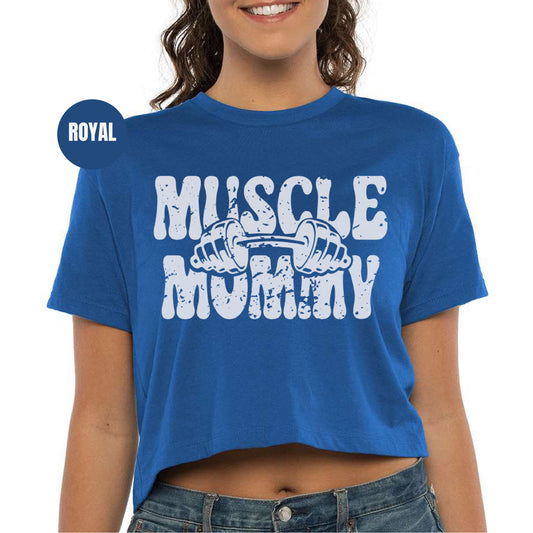 a woman wearing a blue shirt that says musclee muffin