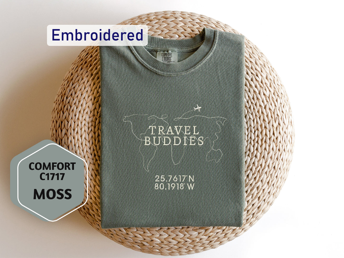 a travel buddies t - shirt sitting on a wicker basket