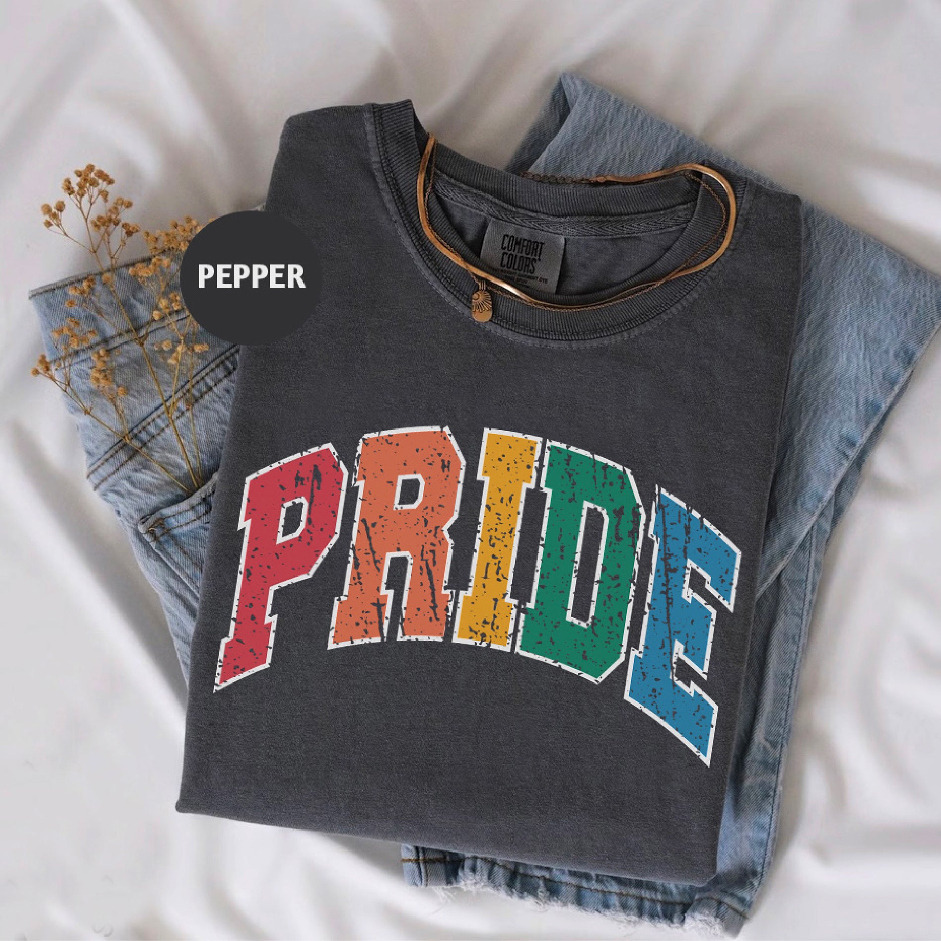 a t - shirt with the word pride printed on it