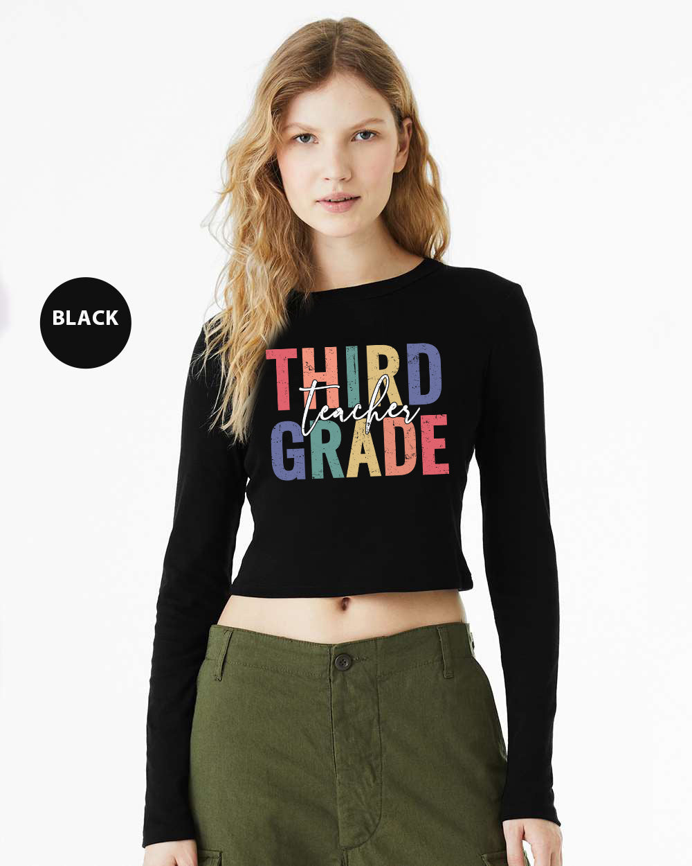 a woman wearing a black crop top that says third grade