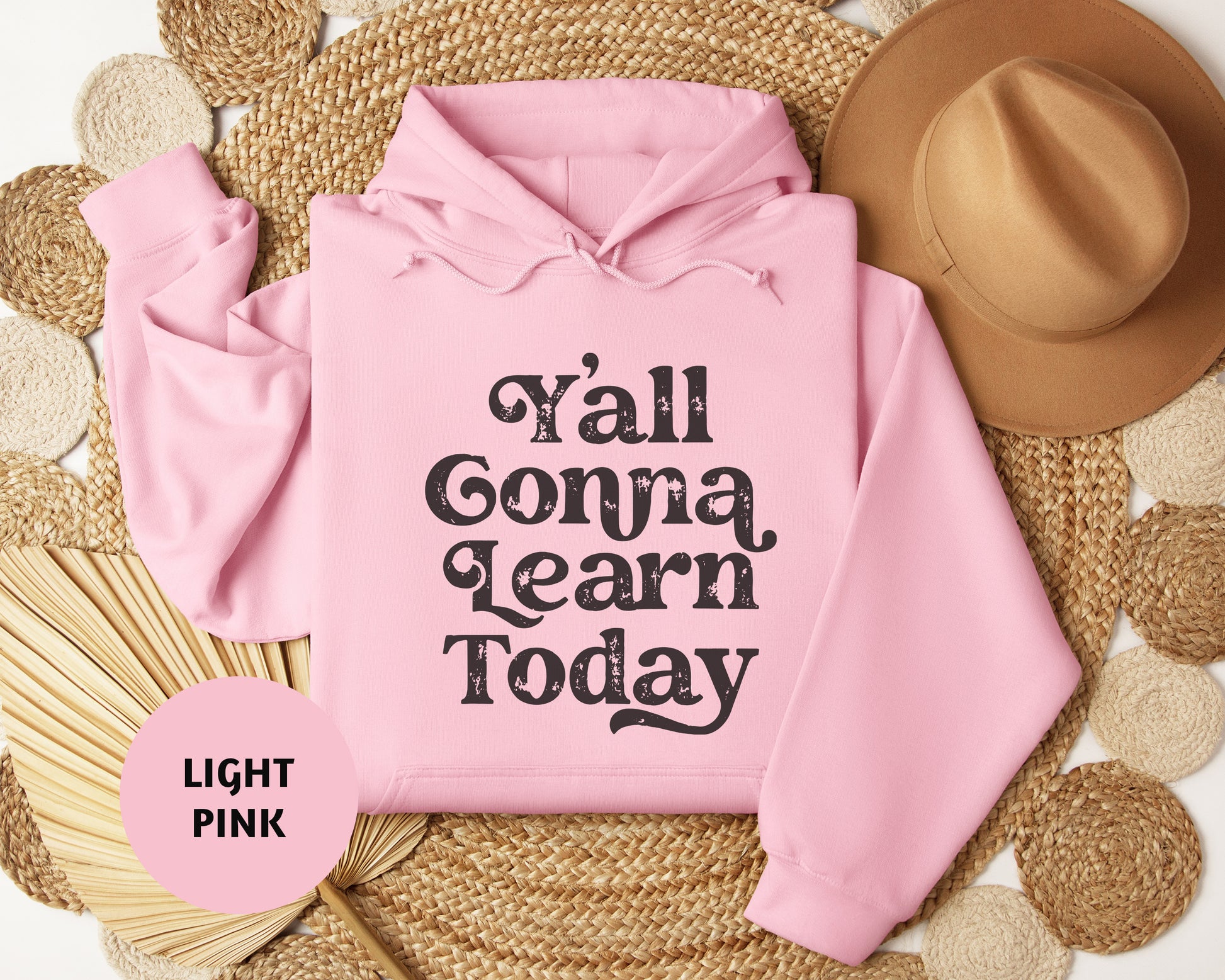 a pink hoodie with the words y'all conna learn today on it