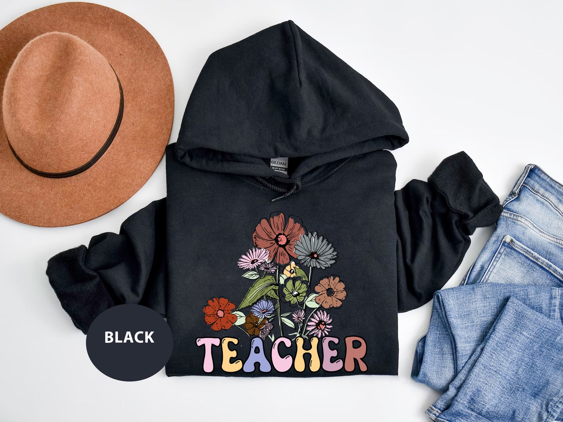 a black hoodie with a flower design on it