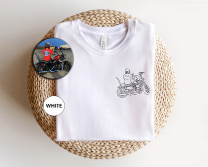 a white t - shirt with a picture of a motorcycle on it