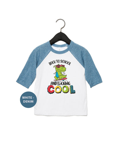 a white and blue shirt with a dinosaur on it