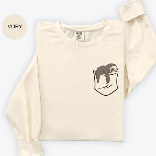 a white shirt with a black bear in a pocket