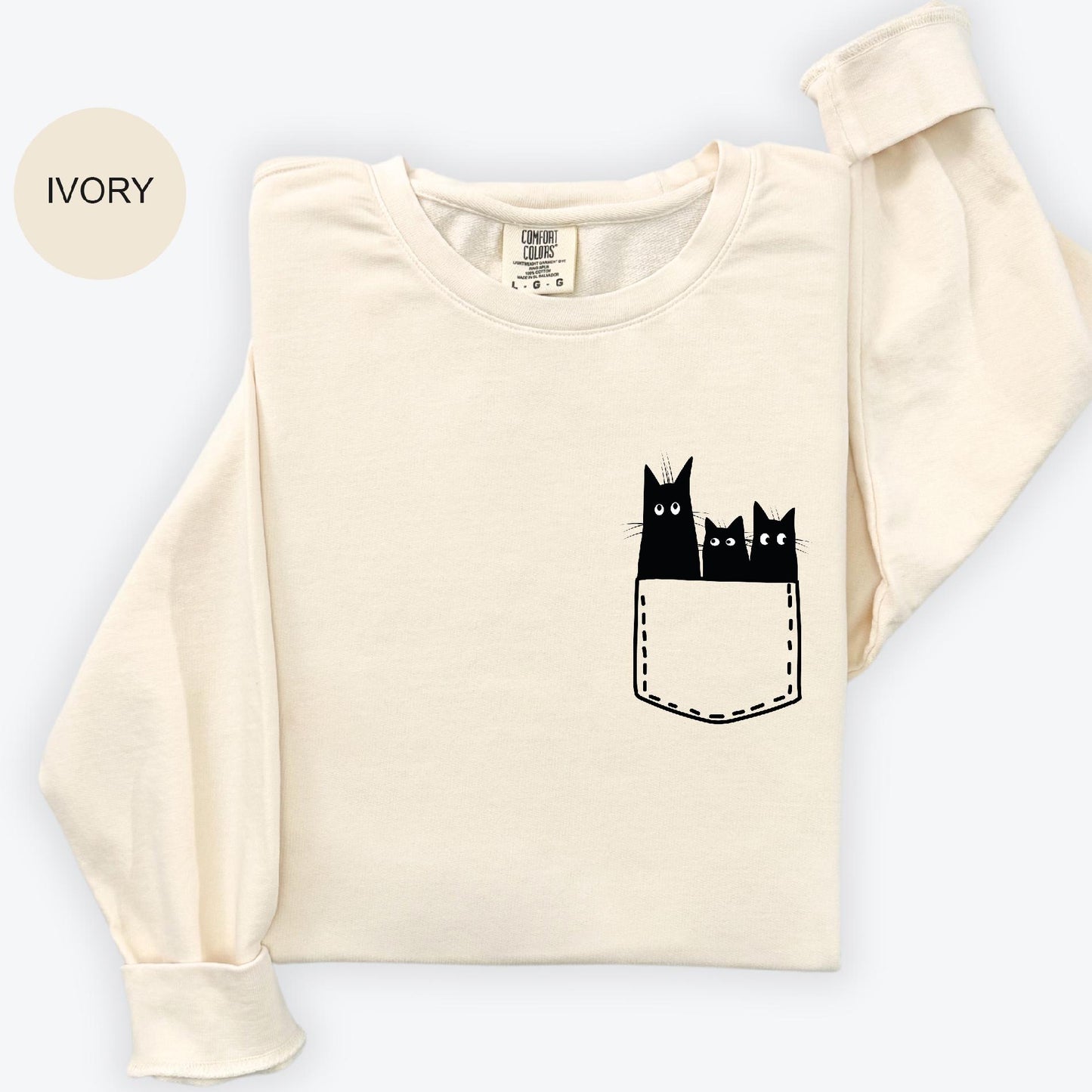 a t - shirt with three cats in a pocket