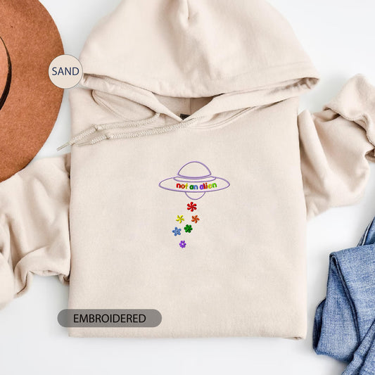 a white hoodie with a mexican design on it