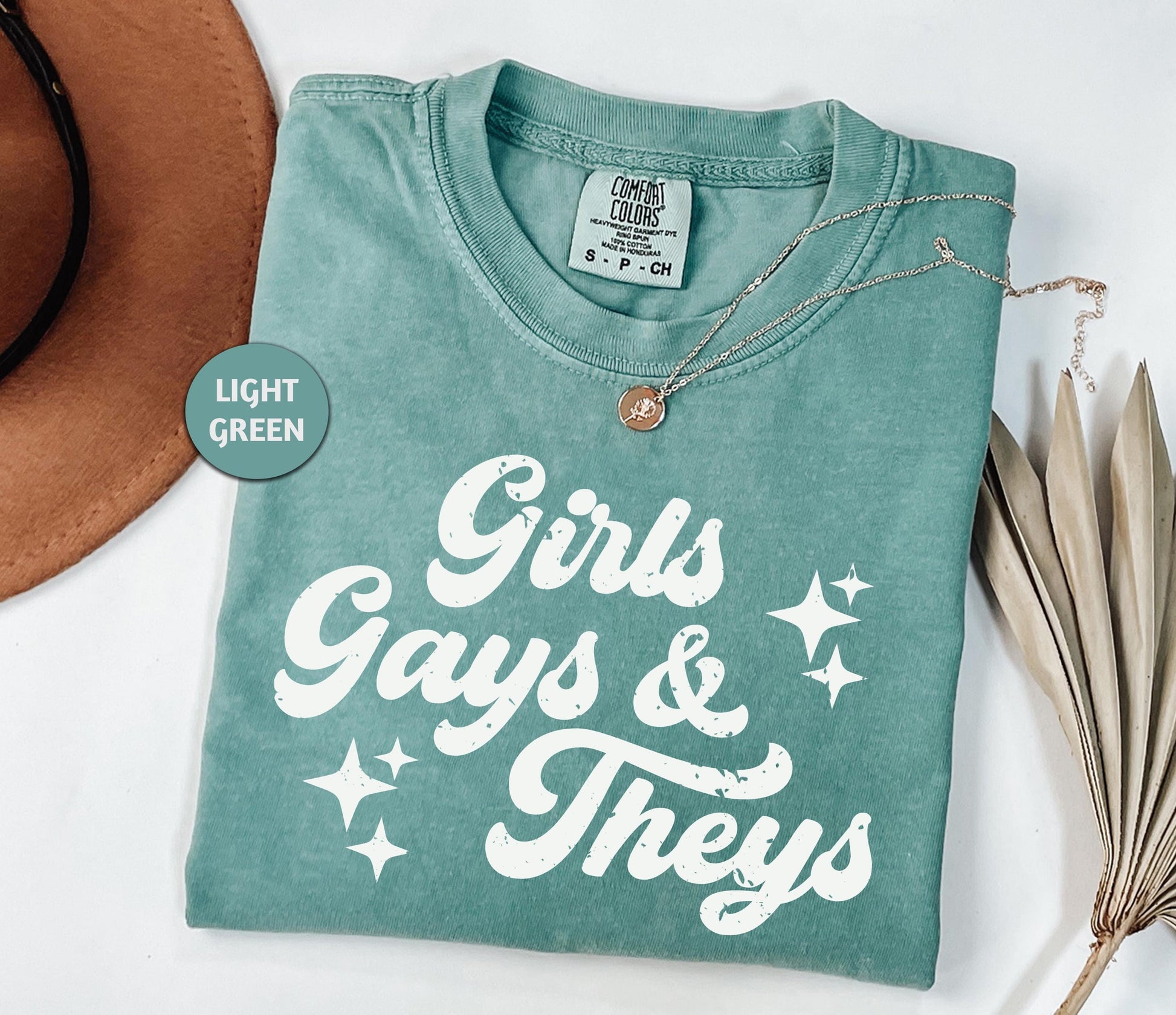 a t - shirt that says girls, gays and they's next to