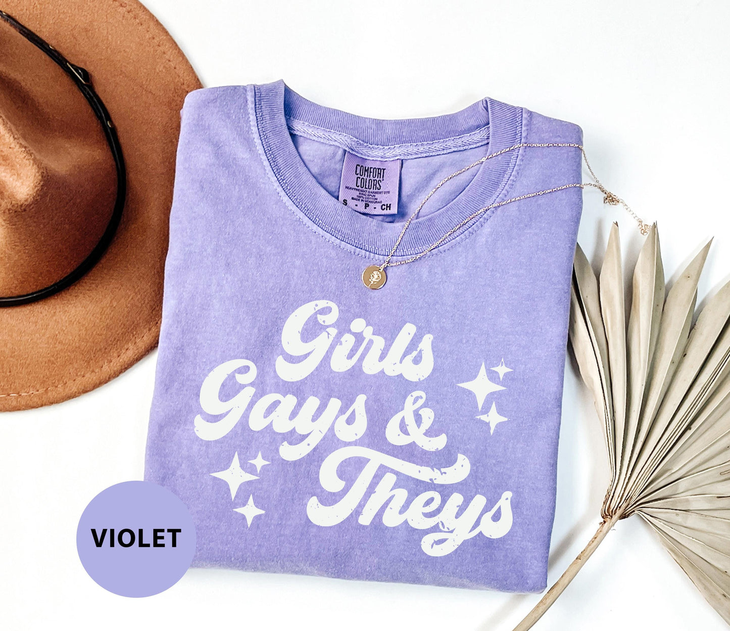 a t - shirt that says girls, gays and theys next to a