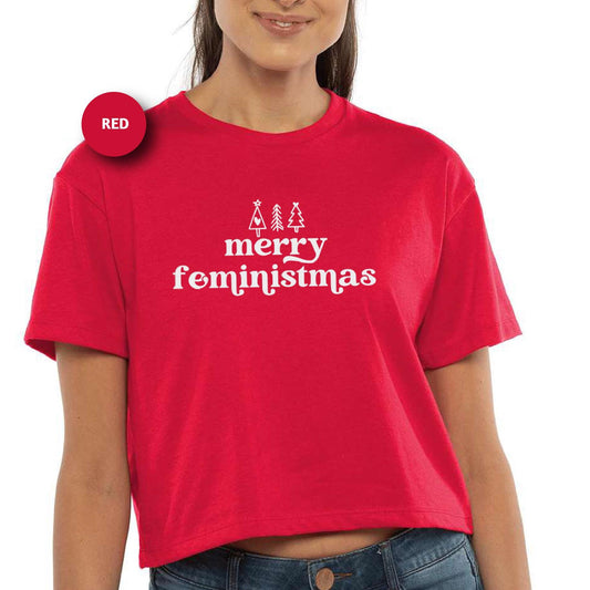 a woman wearing a red merry christmas crop top