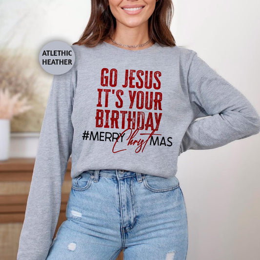 a woman wearing a sweatshirt that says go jesus it's your birthday