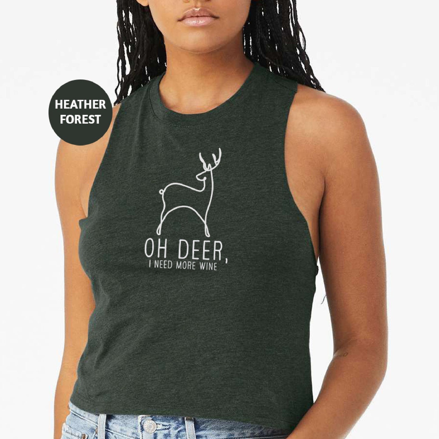 a woman wearing a green tank top with a deer on it