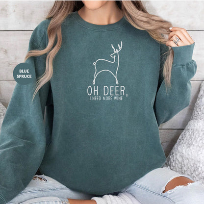 a woman wearing a green sweatshirt with a deer on it