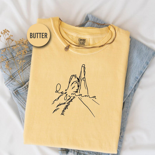 a yellow t - shirt with a picture of a mountain on it