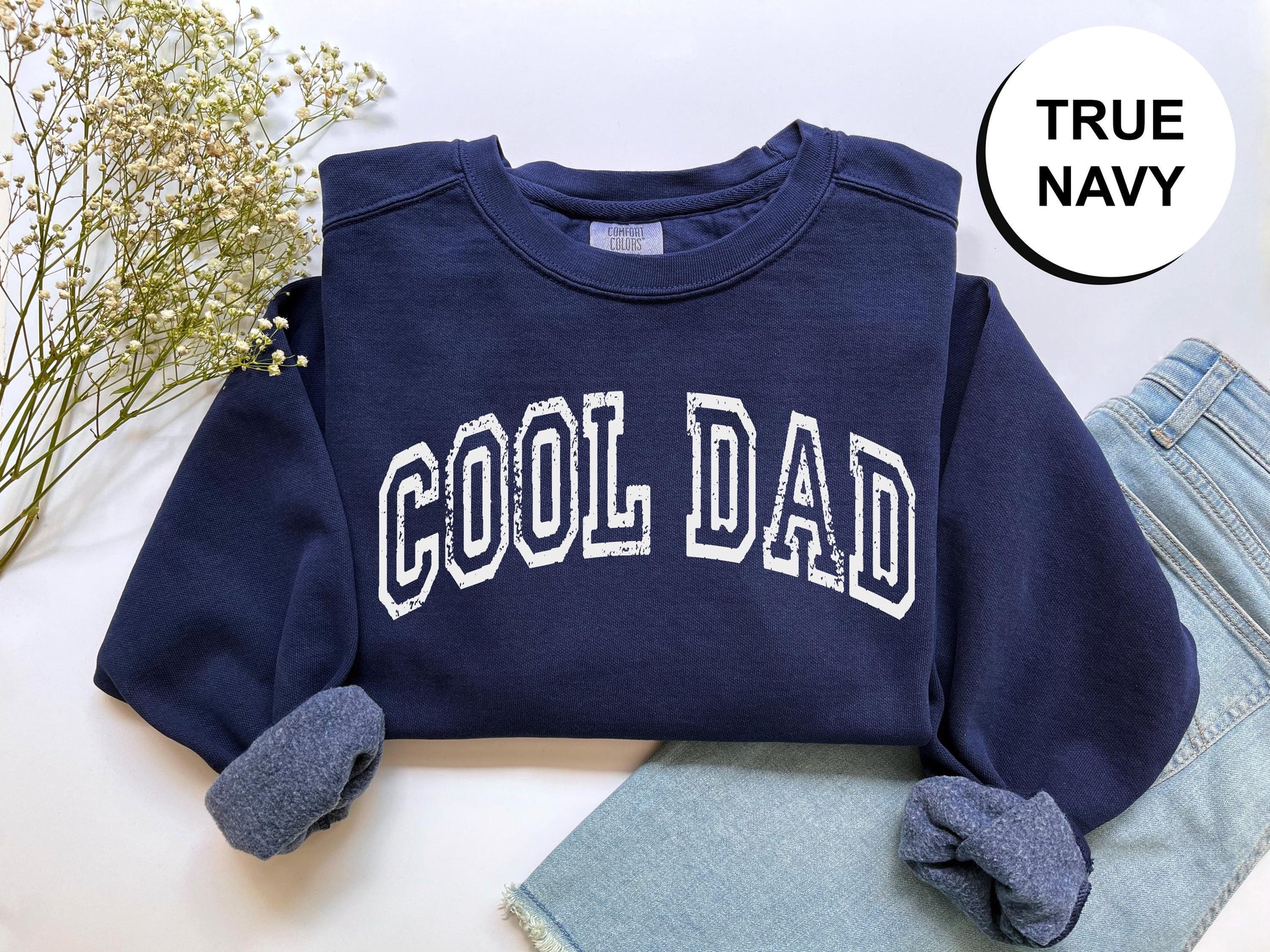 a blue sweatshirt with the word cool dad on it