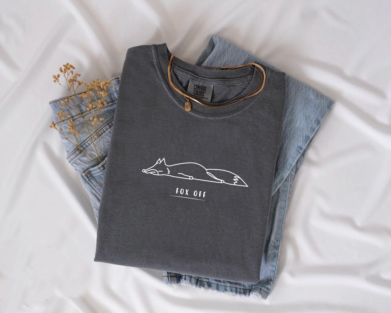 a pair of jeans and a t - shirt on a bed