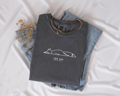 a pair of jeans and a t - shirt on a bed