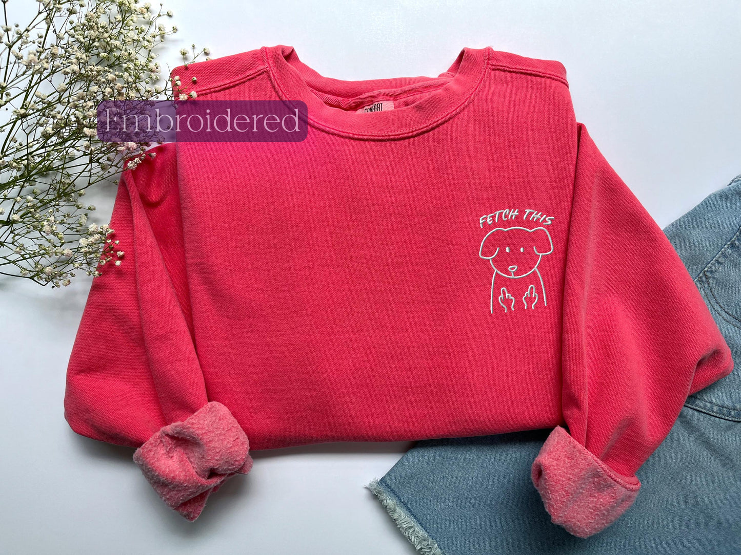 a red shirt with a picture of a dog on it