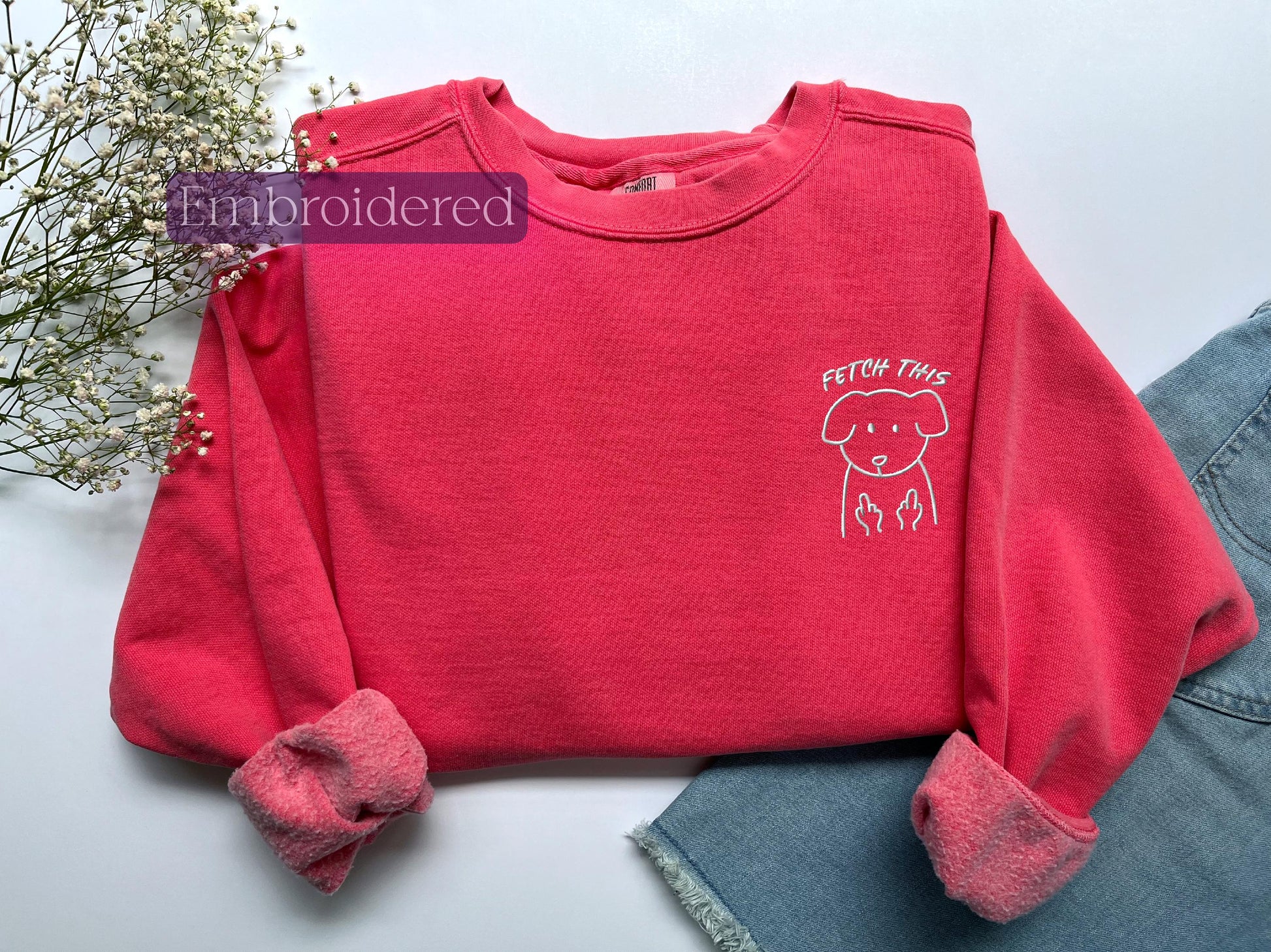 a red shirt with a picture of a dog on it