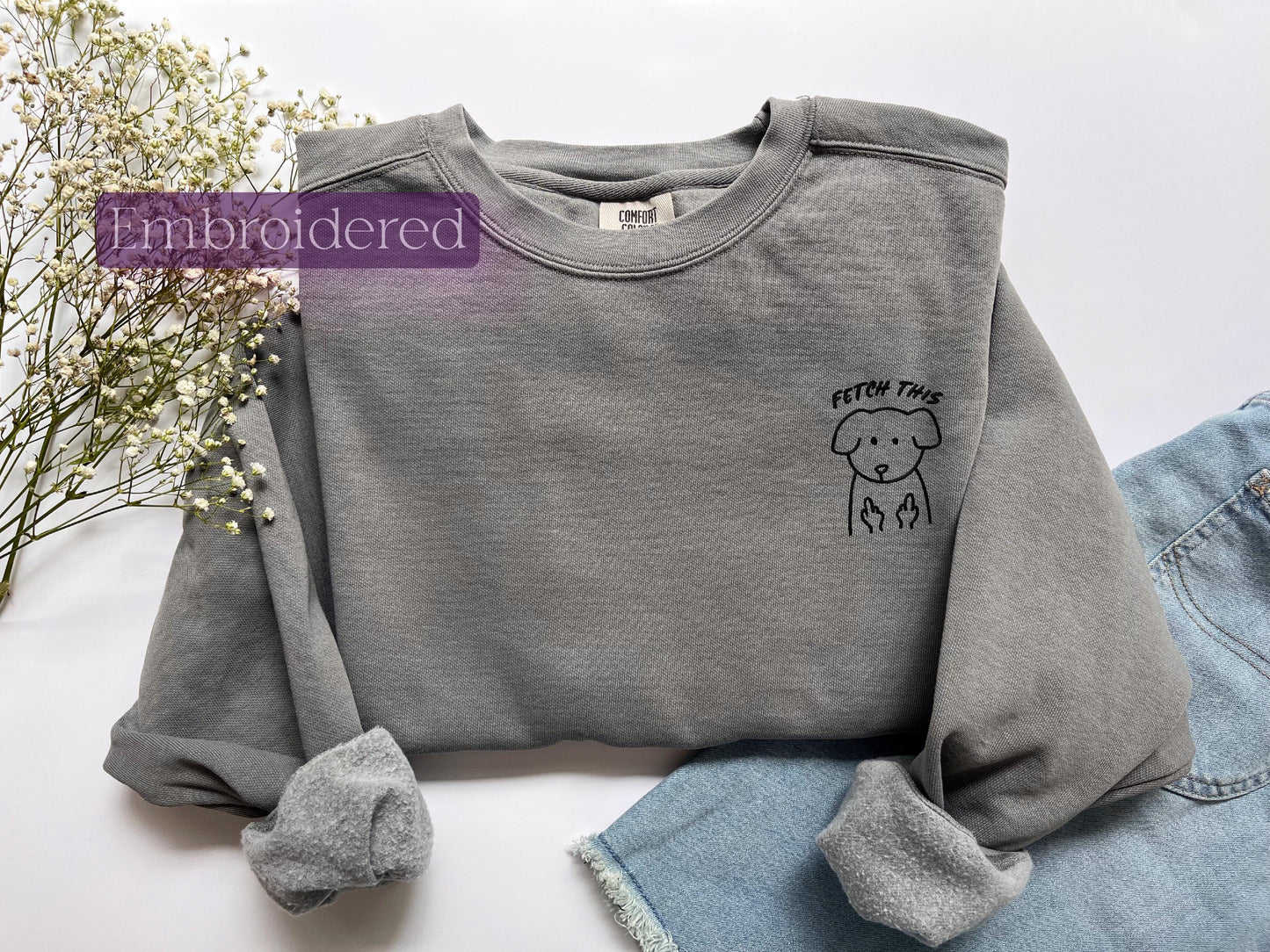 a gray sweater with a picture of a sheep on it