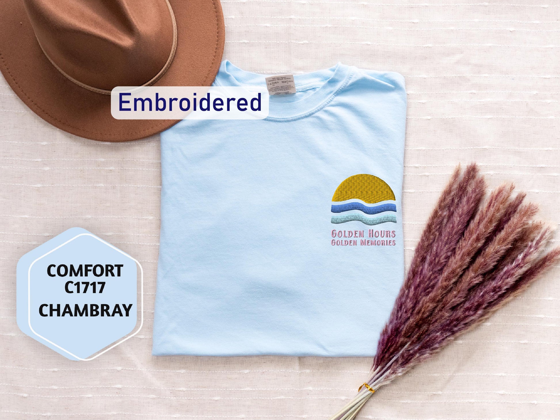 a hat, t - shirt, and dried grass on a table