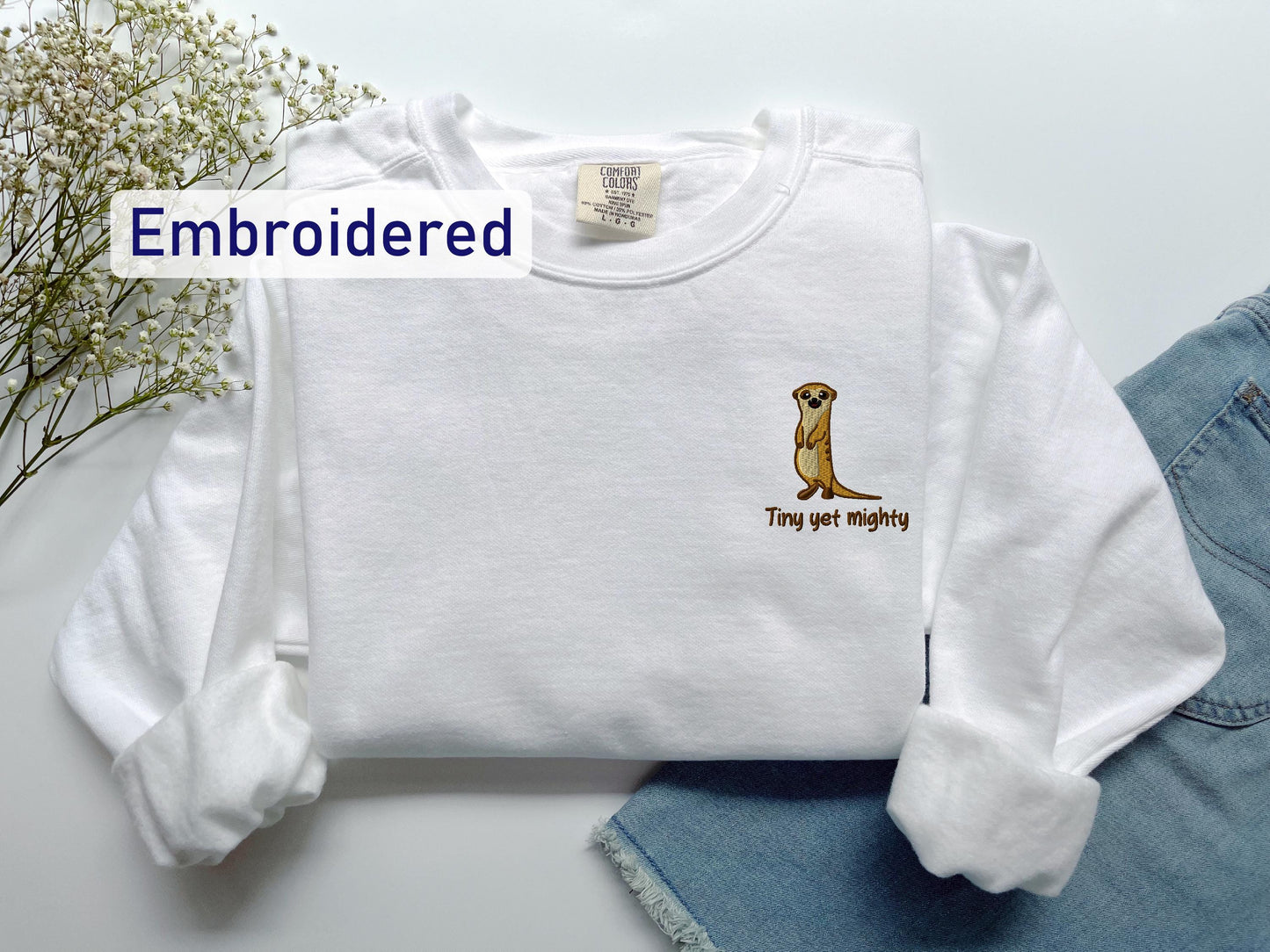 a white shirt with a dog embroidered on it
