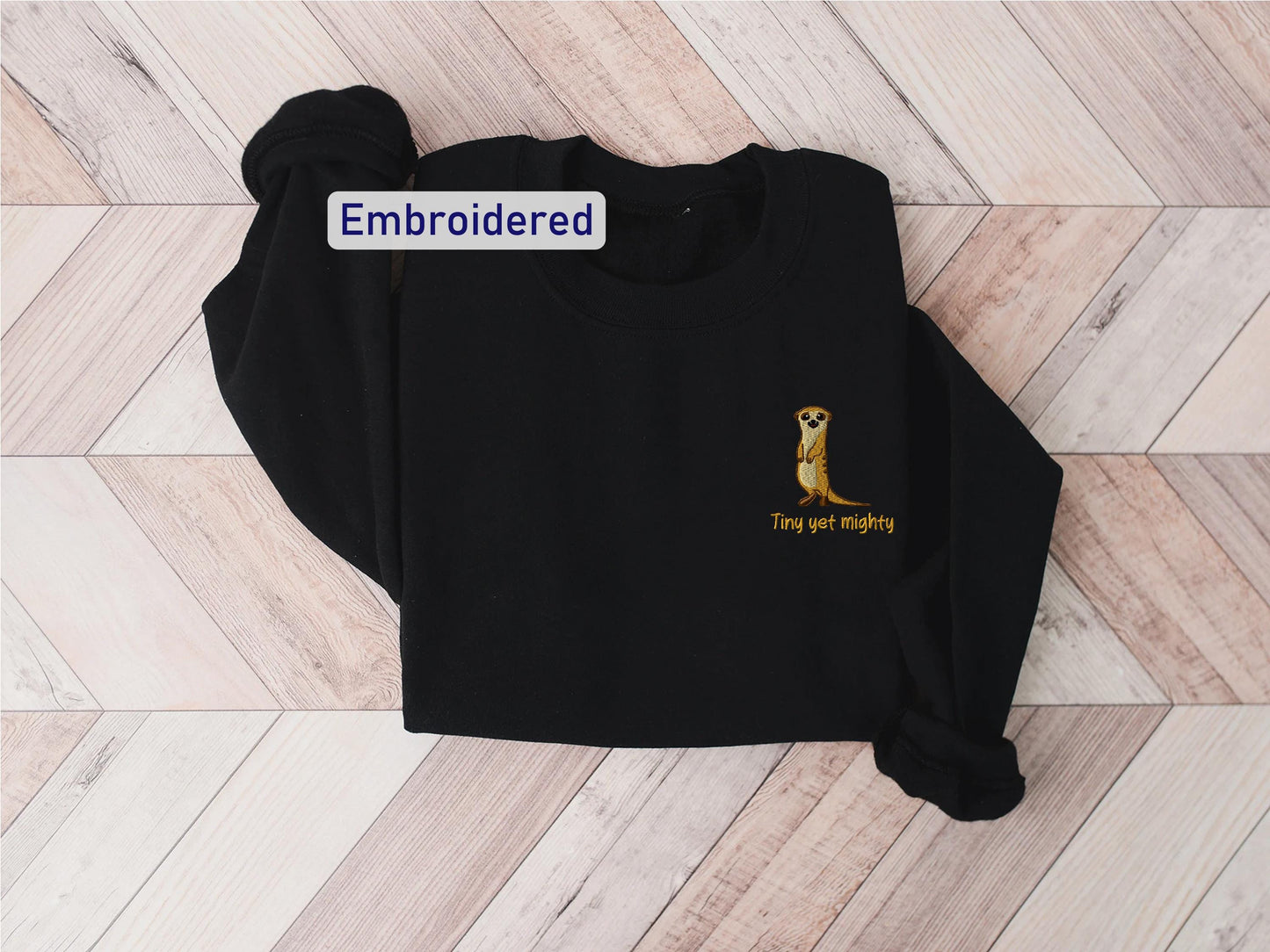 a black shirt with an embroidered kangaroo on it