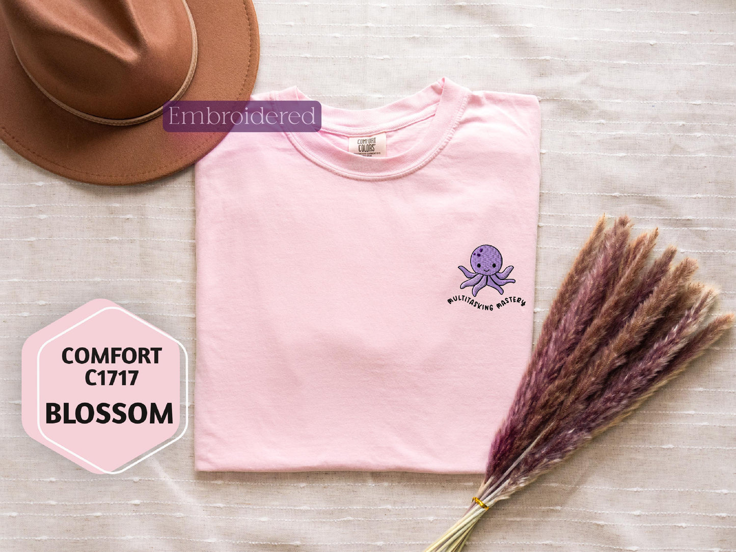 a pink shirt with a purple octopus on it