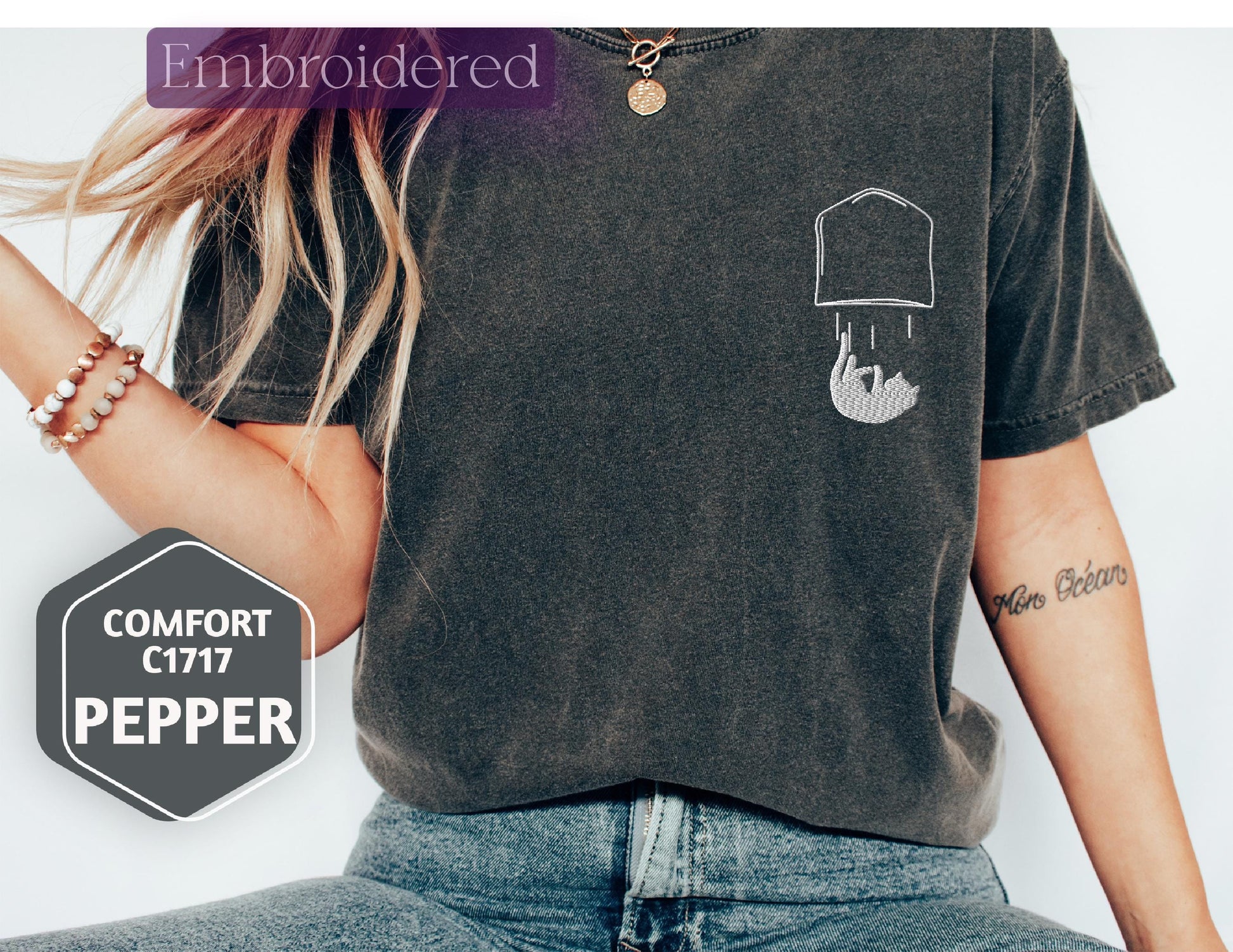a woman wearing a t - shirt with a picture of a hat on it