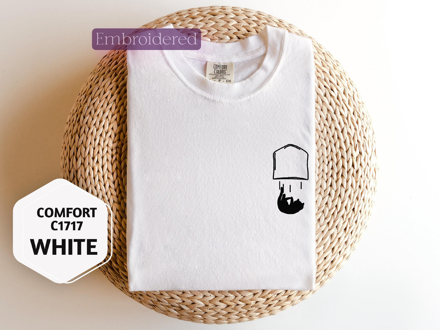 a t - shirt with a picture of a hat on it