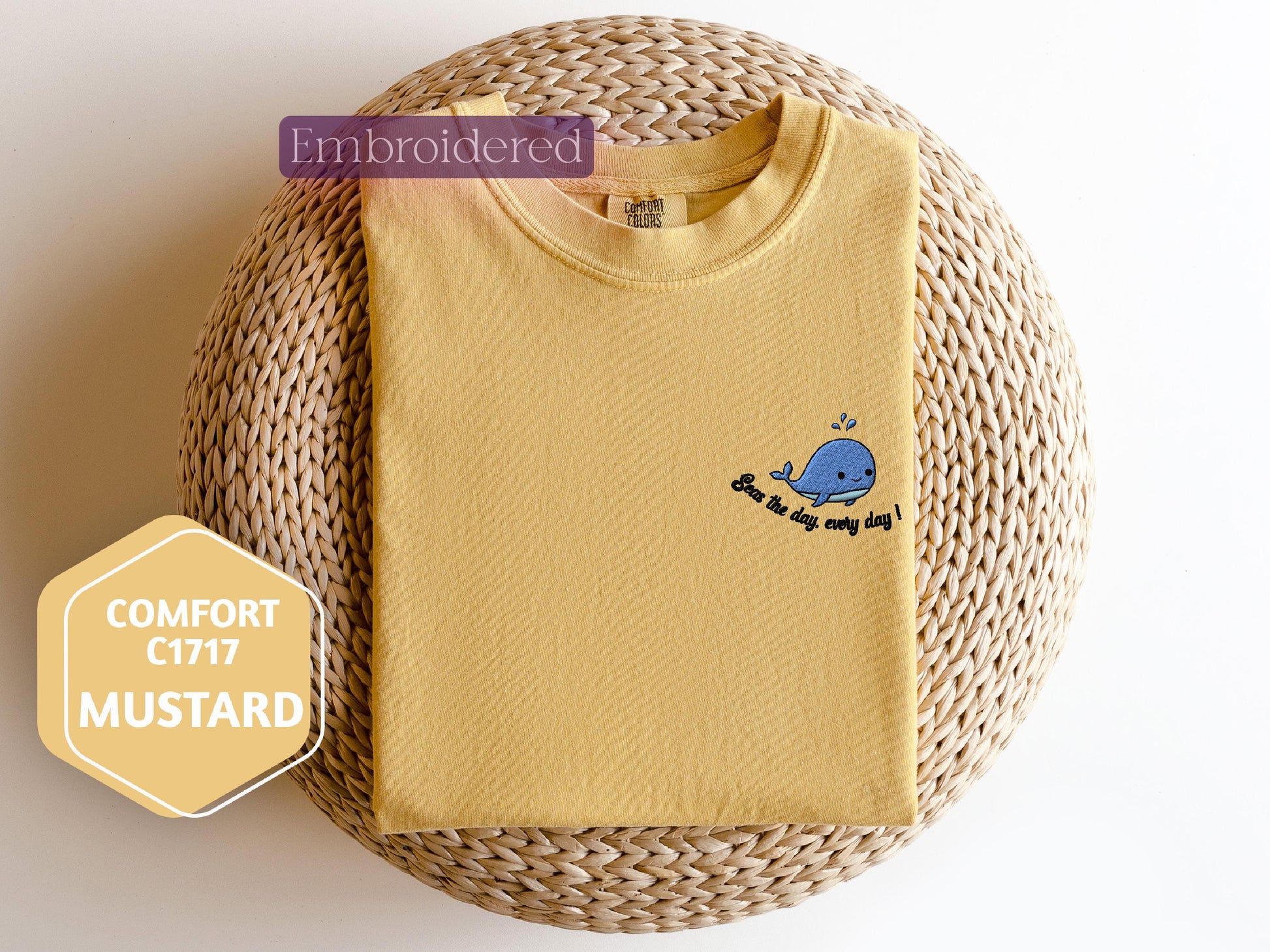 a yellow t - shirt with a blue crab embroidered on it