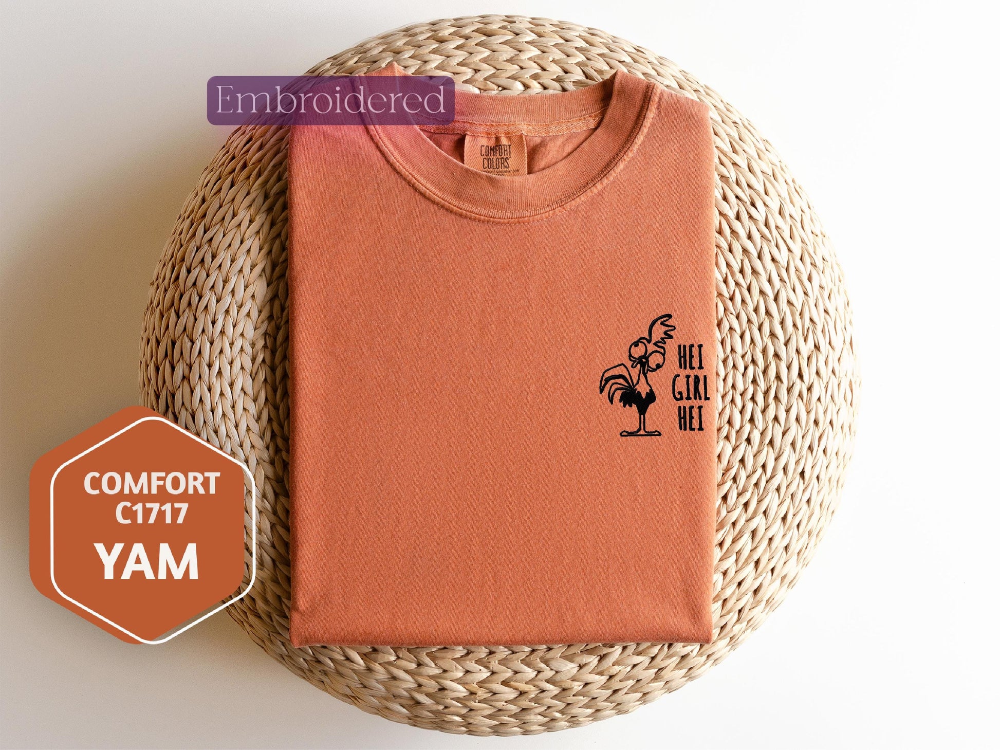 an orange shirt with a rooster on it