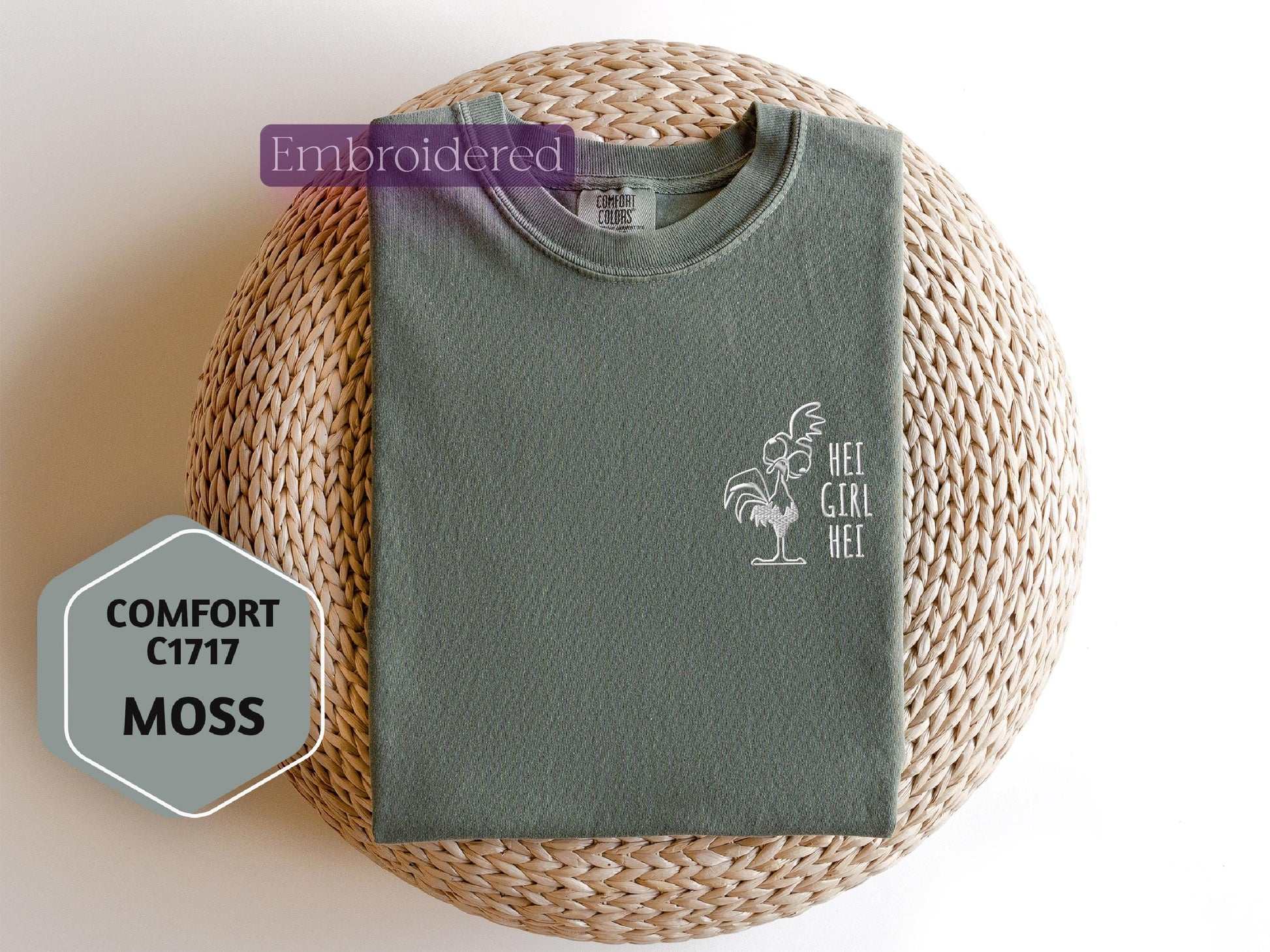 a green t - shirt sitting on top of a wicker basket