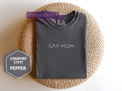 a t - shirt with the word cat mom written on it