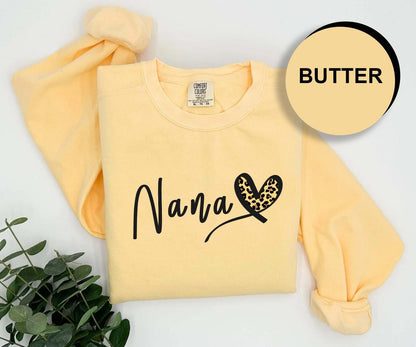 a yellow shirt with a butterfly and name on it