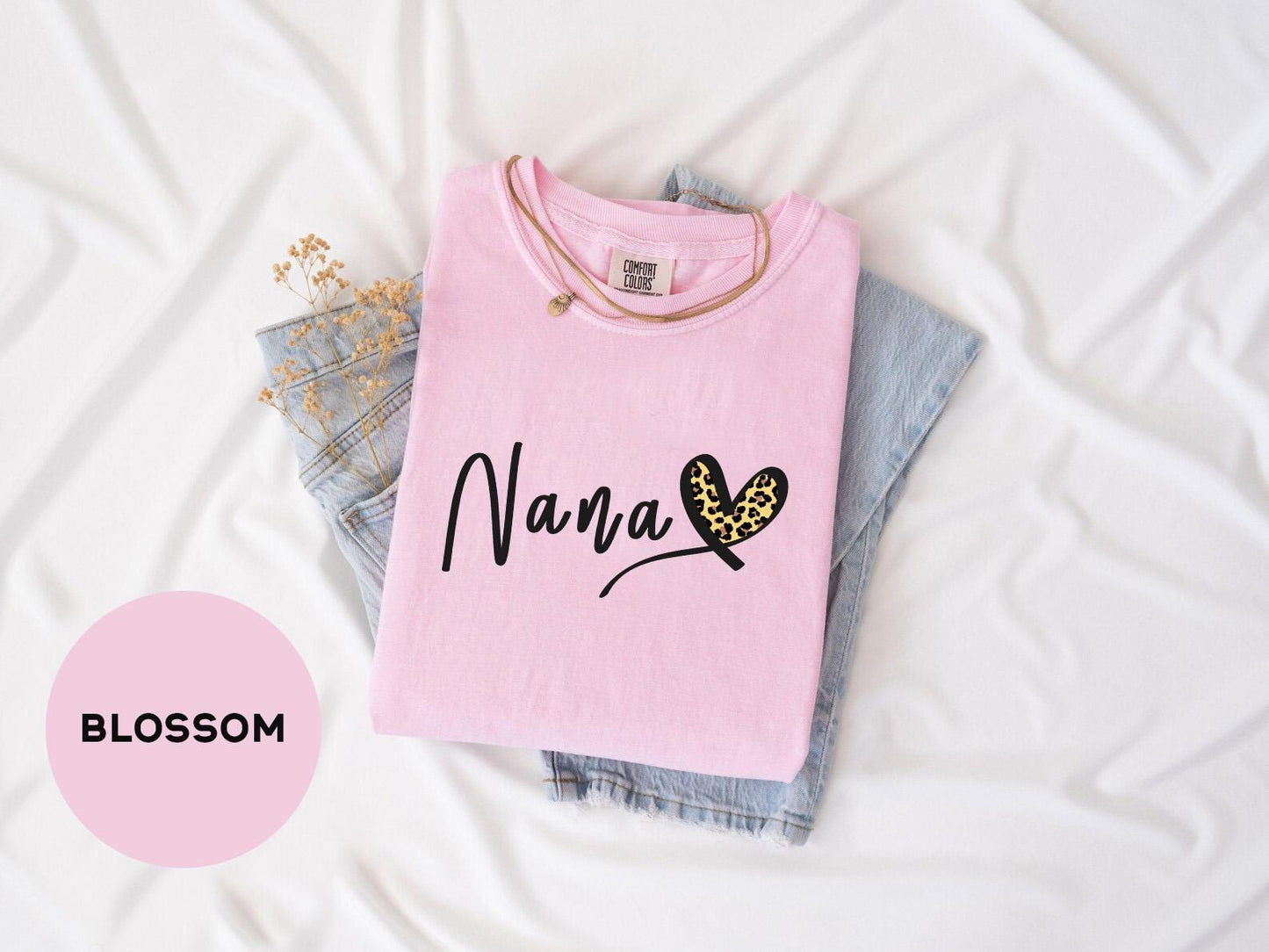 a pink shirt that says mama with a butterfly on it