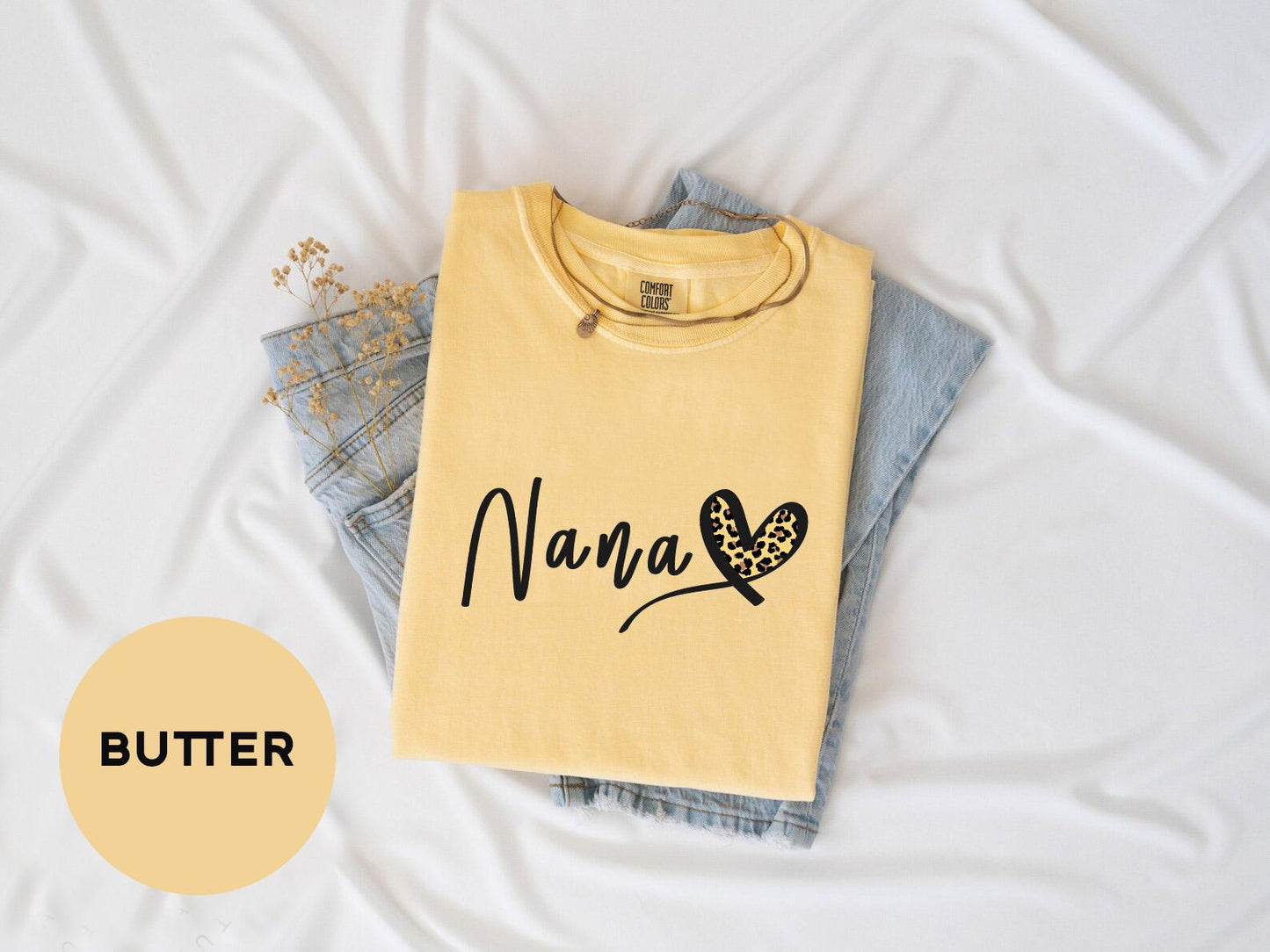 a yellow shirt with a butterfly on it
