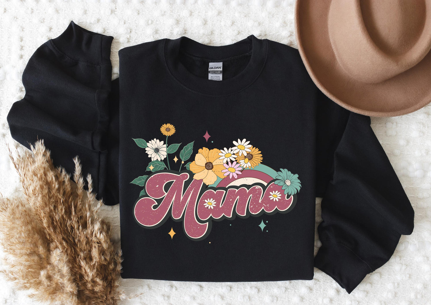 a black shirt with flowers and the word mama on it