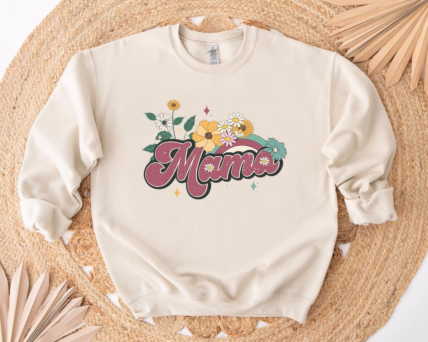 a white sweatshirt with the word mom printed on it