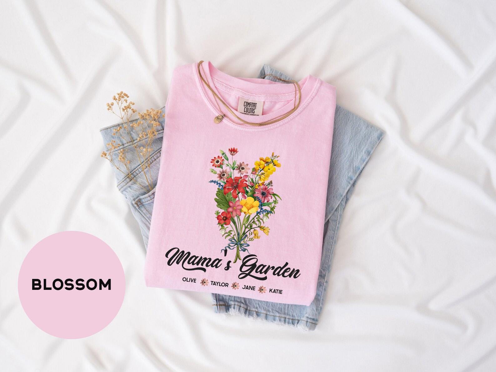 a pink shirt with a floral bouquet on it