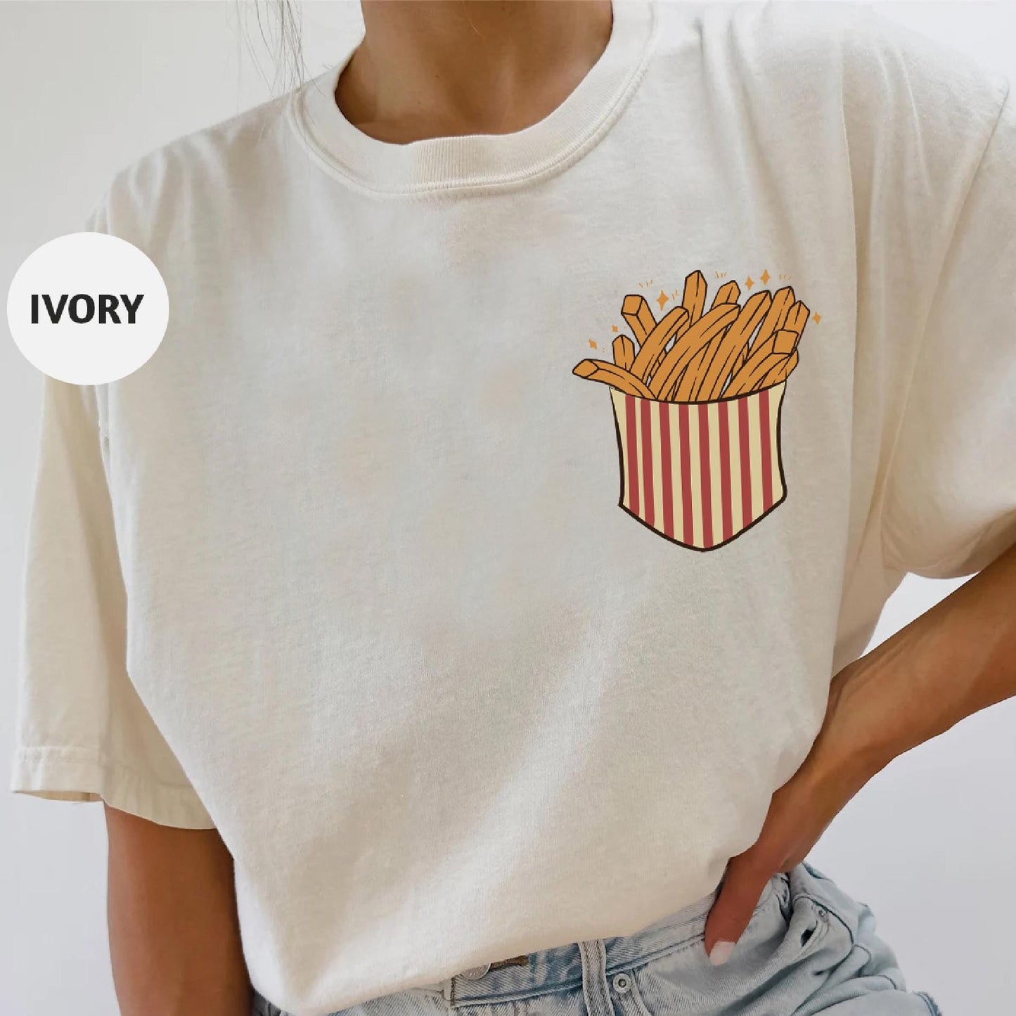 a woman wearing a t - shirt with a french fries pocket