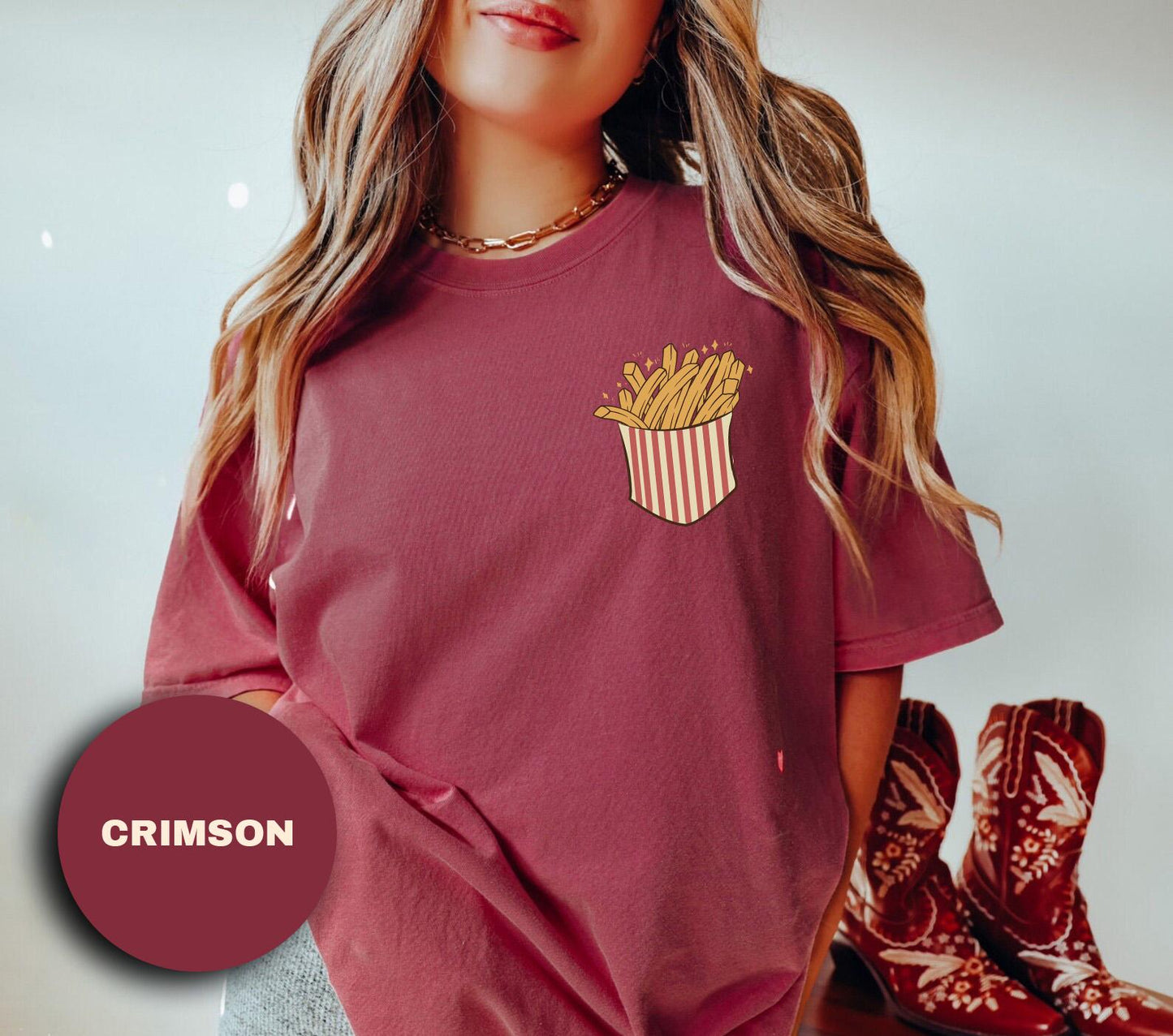 a girl wearing a red shirt with a fries pocket on it