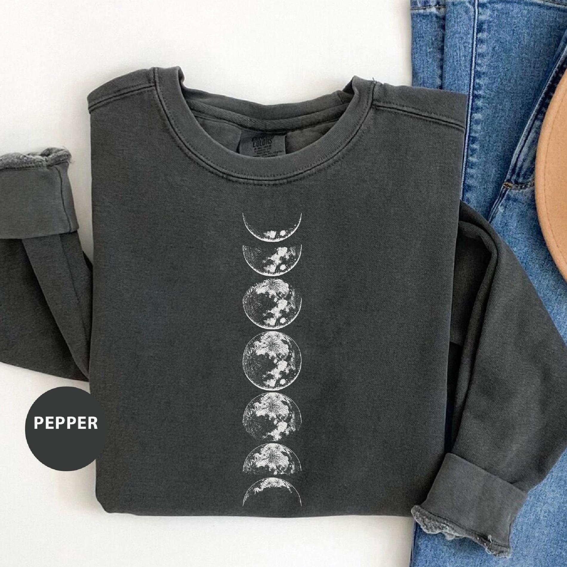 a pair of jeans and a t - shirt with the moon phases