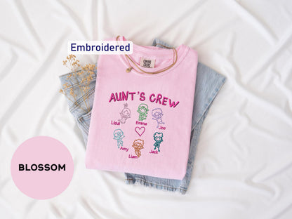 a pink t - shirt that says,'ann's crew'and a