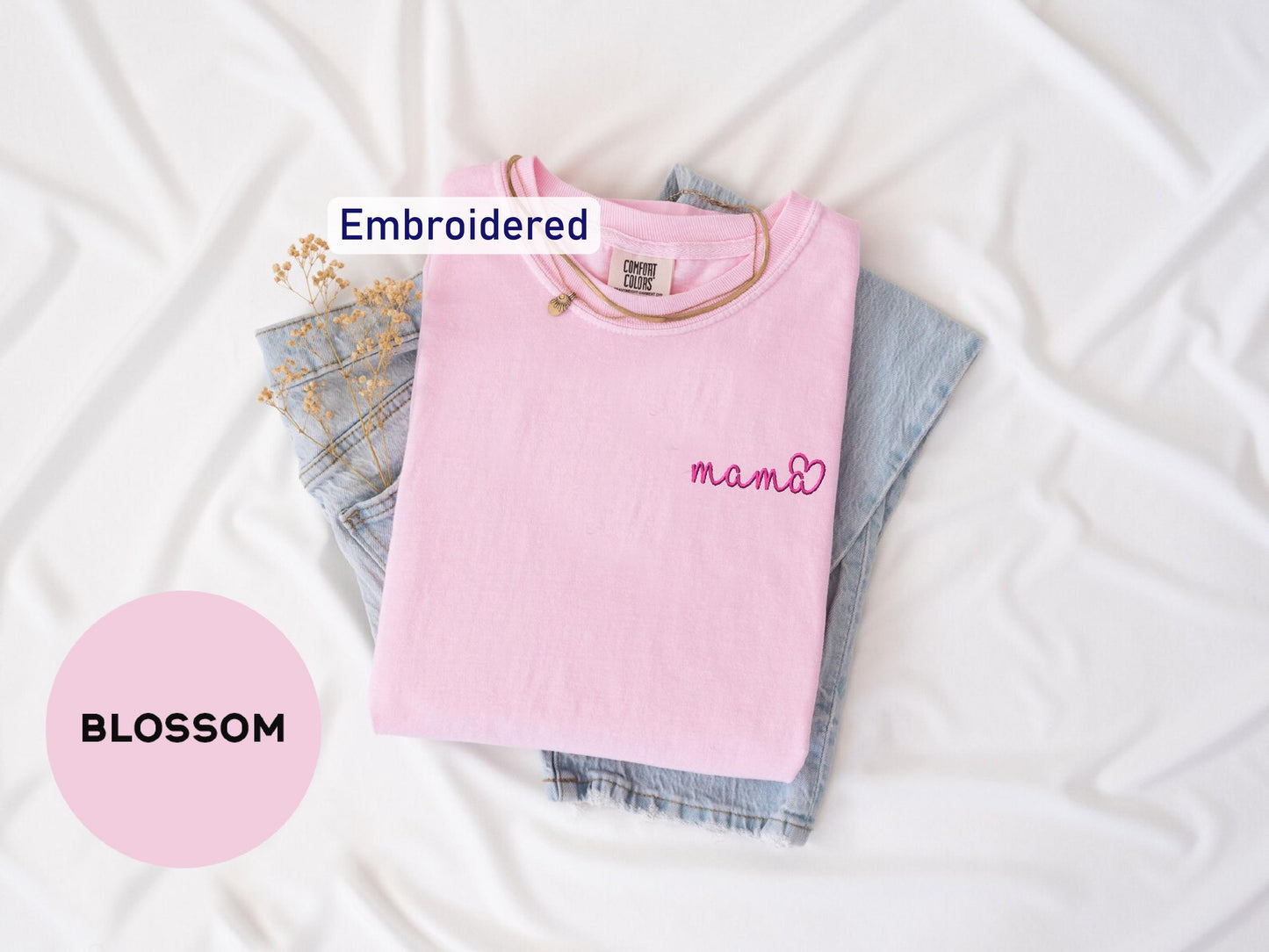 a pink shirt with the word mom written on it